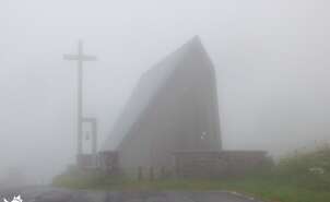 The hermitage of San Salvador appears in the fog