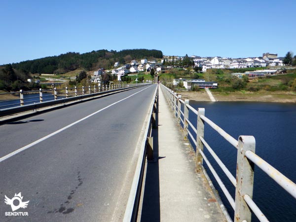 We cross the bridge over the reservoir
